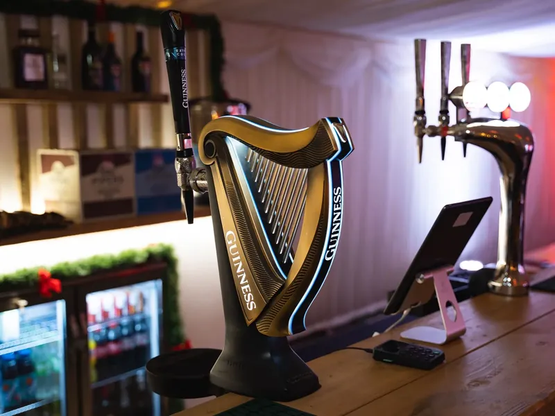 Guinness and beer taps on the wooden counter of the Candy Cane Bar